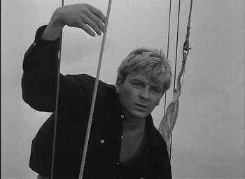 Movie still from “Knife in the Water” (1962), directed by Roman Polanski – Black and white photograph of a man holding a rope; Close Up shot, Low angle