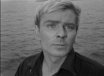 Movie still from “Knife in the Water” (1962), directed by Roman Polanski – Black and white photograph of a man in front of a body of water; Close Up shot, High angle