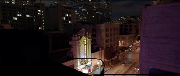 Movie still from “Knight of Cups” (2015), directed by Terrence Malick – A view of a theater from a car window at night; Extreme Wide shot, High angle