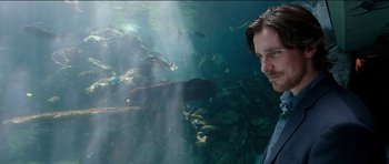 Movie still from “Knight of Cups” (2015), directed by Terrence Malick – A man standing in front of a body of water; Close Up shot, Over the shoulder angle
