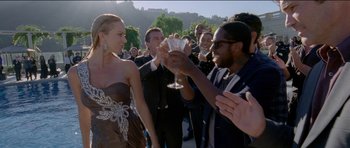 Movie still from “Knight of Cups” (2015), directed by Terrence Malick – A man and a woman are toasting each other; Medium shot, Over the shoulder angle