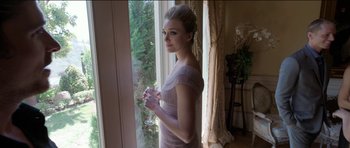 Movie still from “Knight of Cups” (2015), directed by Terrence Malick – A beautiful young lady standing in front of a window; Medium shot, Low angle