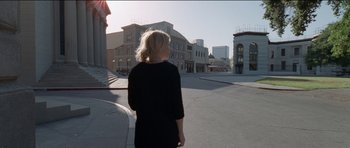 Movie still from “Knight of Cups” (2015), directed by Terrence Malick – A woman is standing on the side of the street; Extreme Wide shot, High angle