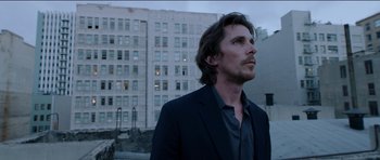 Movie still from “Knight of Cups” (2015), directed by Terrence Malick – A person wearing a suit and tie; Close Up shot, Low angle
