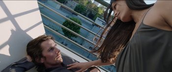 Movie still from “Knight of Cups” (2015), directed by Terrence Malick – A man and a woman are sitting on a ledge; Medium shot, Overhead angle