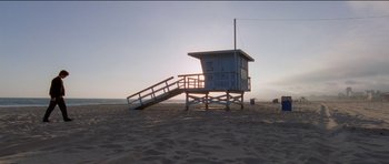 Movie still from “Knight of Cups” (2015), directed by Terrence Malick – A lifeguard tower on the beach at sunset; Extreme Wide shot, Low angle