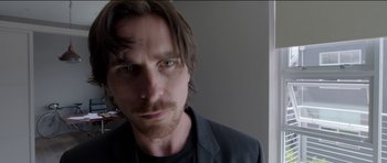 Movie still from “Knight of Cups” (2015), directed by Terrence Malick – A person with long hair and a beard; Close Up shot, Low angle