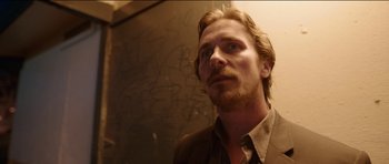 Movie still from “Knight of Cups” (2015), directed by Terrence Malick – A person wearing a suit; Close Up shot, Low angle