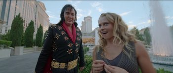 Movie still from “Knight of Cups” (2015), directed by Terrence Malick – A man and a woman standing next to each other in front of a building; Close Up shot, Over the shoulder angle