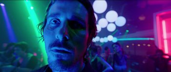 Movie still from “Knight of Cups” (2015), directed by Terrence Malick – A person in a dark room; Close Up shot, Low angle