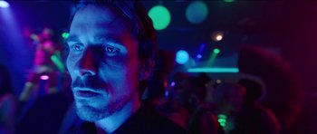 Movie still from “Knight of Cups” (2015), directed by Terrence Malick – A person in a dark room; Close Up shot, Low angle