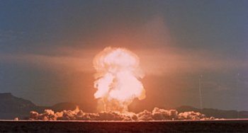 Movie still from “Koyaanisqatsi” (1982), directed by Godfrey Reggio – A nuclear bomb is detonating in the middle of the sky; Extreme Wide shot, Low angle