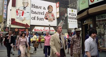 Movie still from “Koyaanisqatsi” (1982), directed by Godfrey Reggio – A crowd of people walking down a street; Wide shot, High angle