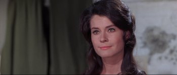 Movie still from “Krakatoa: East of Java” (1968), directed by Bernard L. Kowalski – A person with long black hair; Close Up shot, Low angle