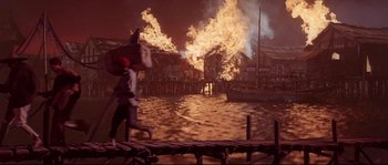 Movie still from “Krakatoa: East of Java” (1968), directed by Bernard L. Kowalski – A man walking across a bridge near a body of water; Wide shot, High angle