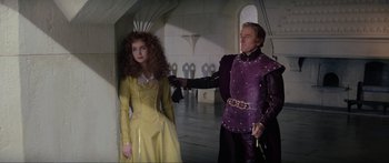 Movie still from “Krull” (1983), directed by Peter Yates – A man and a woman dressed in medieval garb; Medium shot, Over the shoulder angle