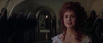 Movie still from “Krull” (1983), directed by Peter Yates – A person wearing a dress; Close Up shot, Over the shoulder angle