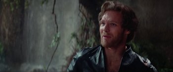 Movie still from “Krull” (1983), directed by Peter Yates – A person wearing a leather jacket; Close Up shot, Over the shoulder angle