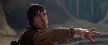 Movie still from “Krull” (1983), directed by Peter Yates – A man pointing at something in the distance; Close Up shot, Low angle