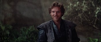 Movie still from “Krull” (1983), directed by Peter Yates – A person wearing a leather jacket; Close Up shot, Over the shoulder angle