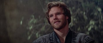Movie still from “Krull” (1983), directed by Peter Yates – A person wearing a leather jacket; Close Up shot, Over the shoulder angle