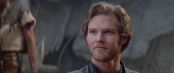 Movie still from “Krull” (1983), directed by Peter Yates – A person wearing a leather jacket; Close Up shot, Low angle