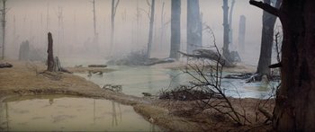 Movie still from “Krull” (1983), directed by Peter Yates – A forest with a body of water in the middle of it; Extreme Wide shot, High angle
