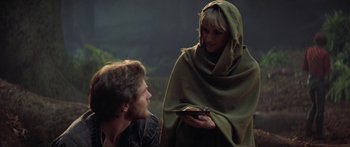 Movie still from “Krull” (1983), directed by Peter Yates – A man and a woman dressed in medieval garb; Medium shot, Over the shoulder angle