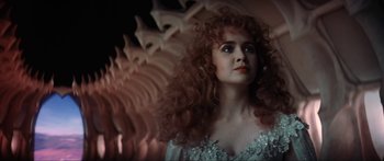 Movie still from “Krull” (1983), directed by Peter Yates – A person with curly hair; Close Up shot, Low angle