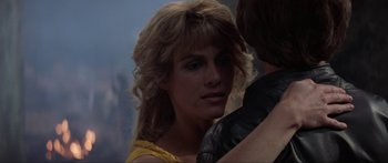 Movie still from “Krull” (1983), directed by Peter Yates – A person wearing a yellow dress; Close Up shot, Over the shoulder angle