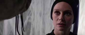 Movie still from “Krull” (1983), directed by Peter Yates – A person wearing a headscarf; Close Up shot, Low angle