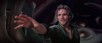 Movie still from “Krull” (1983), directed by Peter Yates – A person holding something in his hand; Close Up shot, Low angle