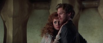 Movie still from “Krull” (1983), directed by Peter Yates – A man and a woman are posing for a picture; Close Up shot, Over the shoulder angle