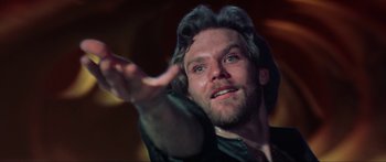 Movie still from “Krull” (1983), directed by Peter Yates – A person with a hand outstretched; Close Up shot, Low angle