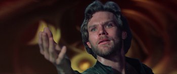 Movie still from “Krull” (1983), directed by Peter Yates – A person holding a hand up; Close Up shot, Low angle