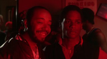 Movie still from “Krush Groove” (1985), directed by Michael Schultz – A couple of men standing next to each other in a room; Close Up shot, Low angle