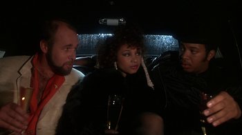 Movie still from “Krush Groove” (1985), directed by Michael Schultz – A group of people sitting in the back of a car; Close Up shot, Over the shoulder angle