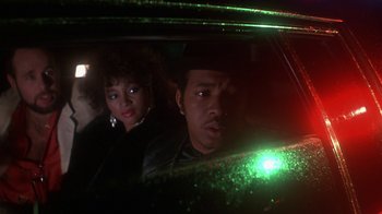 Movie still from “Krush Groove” (1985), directed by Michael Schultz – A man and a woman sitting in a car at night; Close Up shot, Low angle
