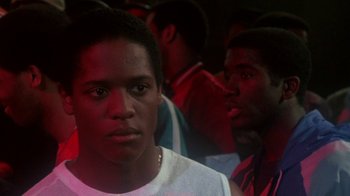 Movie still from “Krush Groove” (1985), directed by Michael Schultz – Two young black men standing next to each other in a room; Close Up shot, Low angle