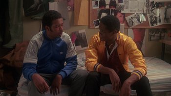 Movie still from “Krush Groove” (1985), directed by Michael Schultz – Two young men sitting on a bed talking to each other; Medium shot, Over the shoulder angle