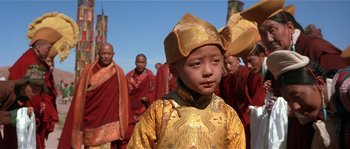 Movie still from “Kundun” (1997), directed by Martin Scorsese – A group of people in traditional clothing and hats; Close Up shot, High angle