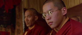 Movie still from “Kundun” (1997), directed by Martin Scorsese – A man in a red robe and a man in a yellow robe; Close Up shot, Low angle