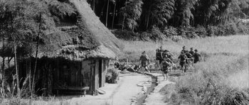 Movie still from “Black Cat” (1968), directed by Kaneto Shindô – A group of people walking down a dirt road; Extreme Wide shot, High angle