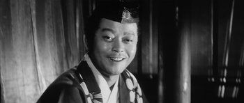 Movie still from “Black Cat” (1968), directed by Kaneto Shindô – An old photo of a man wearing a kimono; Close Up shot, Low angle