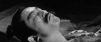 Movie still from “Black Cat” (1968), directed by Kaneto Shindô – A person with a mustache; Close Up shot, High angle