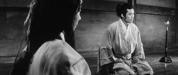 Movie still from “Black Cat” (1968), directed by Kaneto Shindô – A man and a woman in traditional japanese garb; Medium shot, Over the shoulder angle