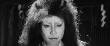 Movie still from “Black Cat” (1968), directed by Kaneto Shindô – A black and white photo of a woman with long hair; Close Up shot, Low angle