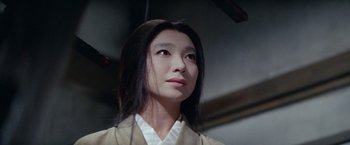 Movie still from “Kwaidan” (1964), directed by Masaki Kobayashi – A woman with long black hair wearing a white shirt; Close Up shot, Low angle