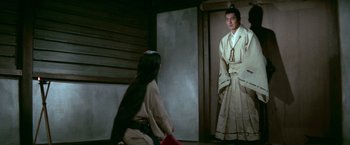 Movie still from “Kwaidan” (1964), directed by Masaki Kobayashi – A man and a woman dressed in traditional japanese clothing; Medium shot, Over the shoulder angle