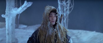 Movie still from “Kwaidan” (1964), directed by Masaki Kobayashi – A man in a straw hat and a coat; Medium shot, High angle